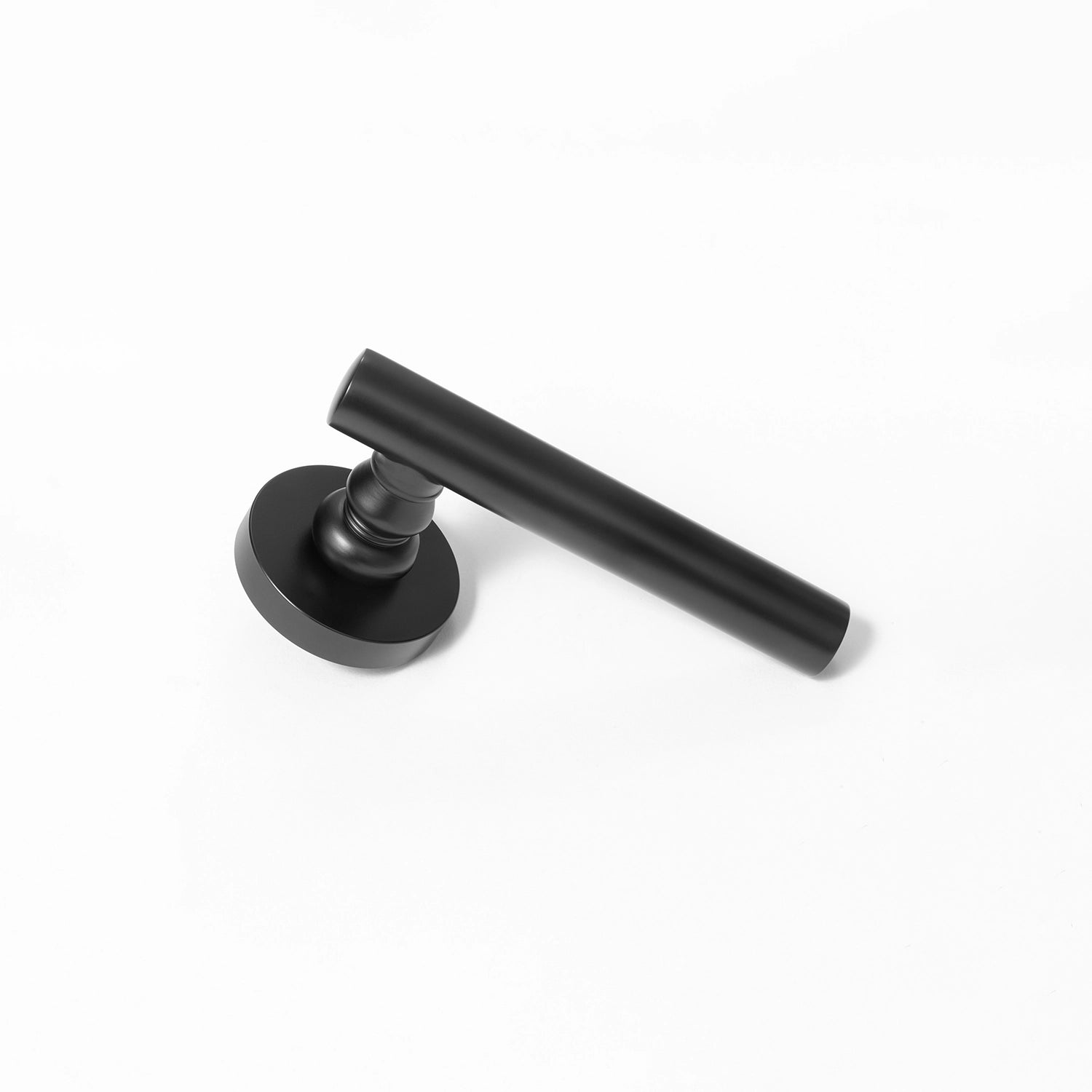 Alda black internal door handle with a round rose, sleek design, positioned vertically standing on its base.