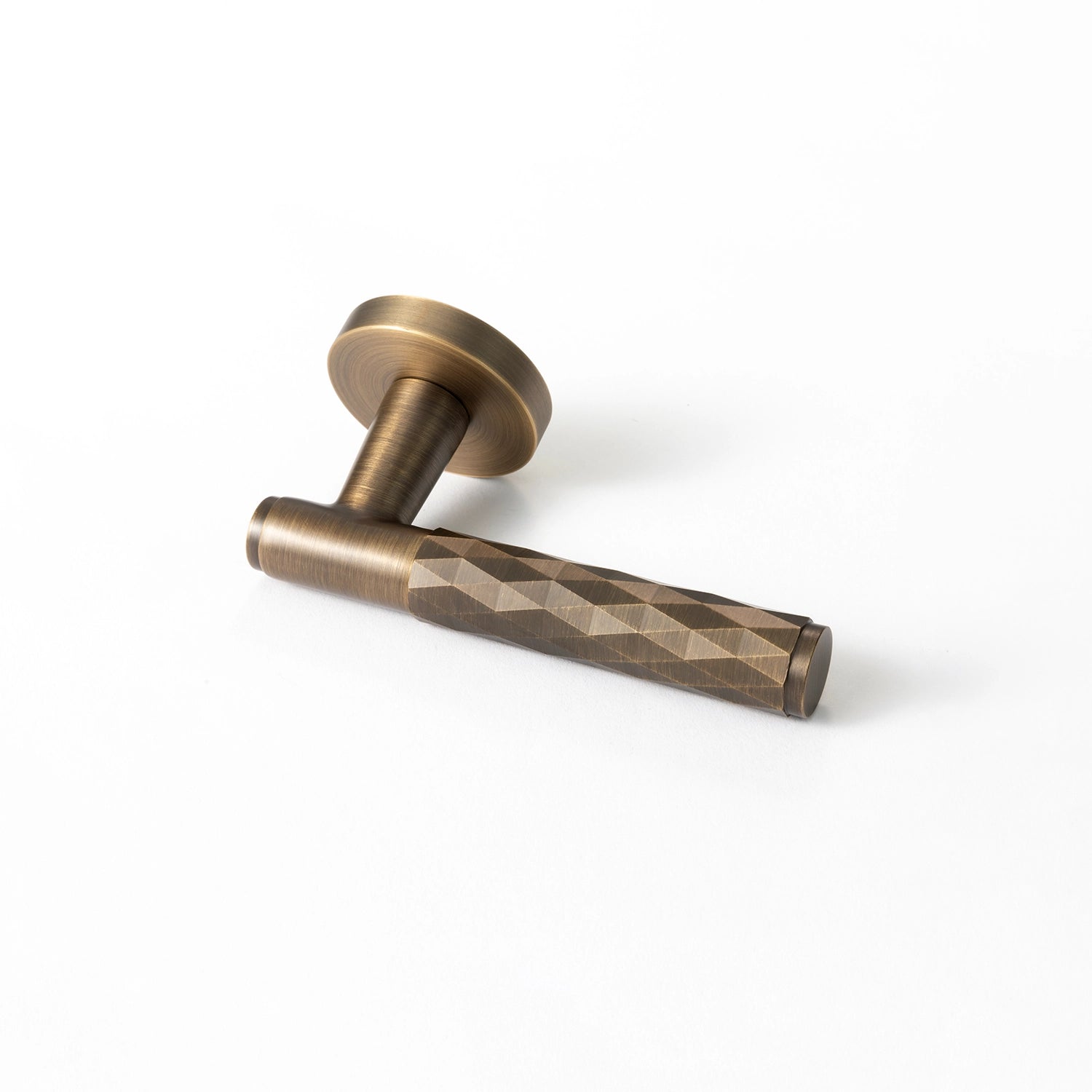 Internal door handle Fendal-01 in antique brass finish, showcasing the front angle with diamond pattern grip.