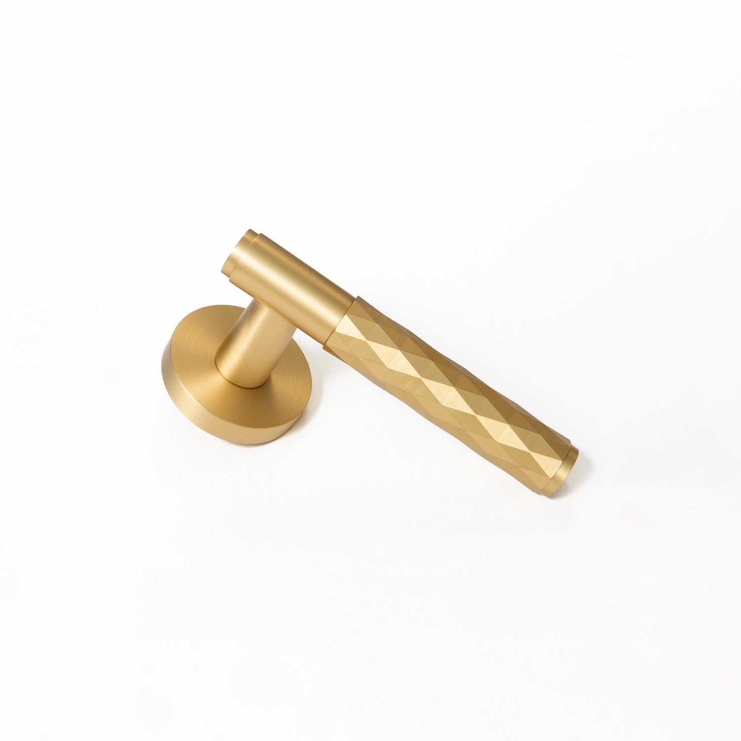 Internal door handle Fendal-01 in satin brass finish, showcasing the bottom angle with diamond pattern grip.