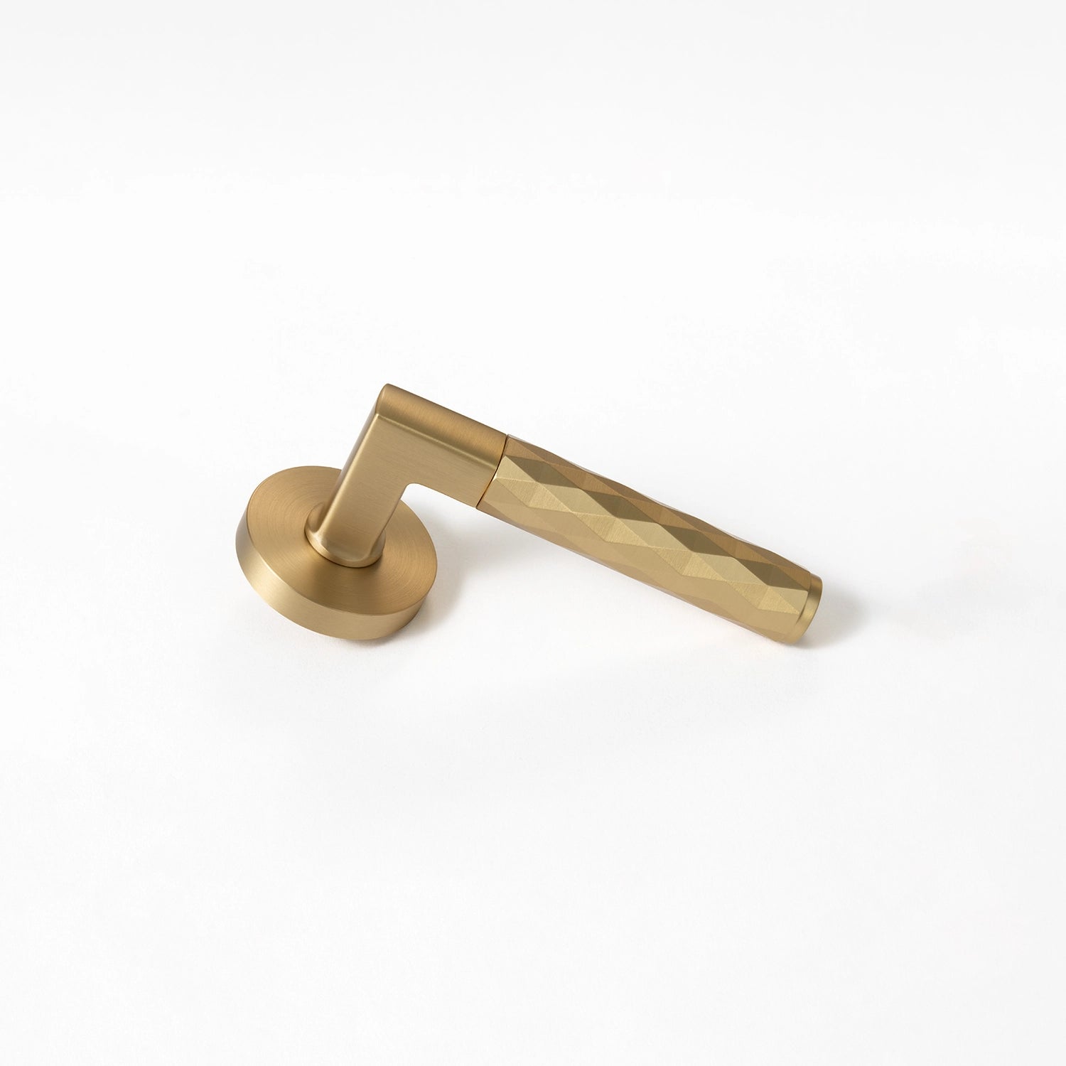Internal door handle Fendal-02 in satin brass finish, showcasing the bottom angle with diamond pattern grip.