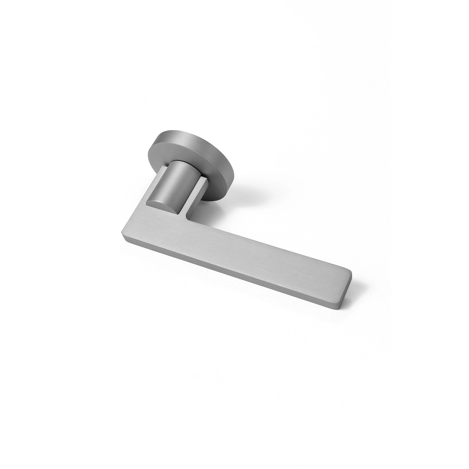 Filda nickel internal door handle with a round rose, positioned horizontally on a flat surface.