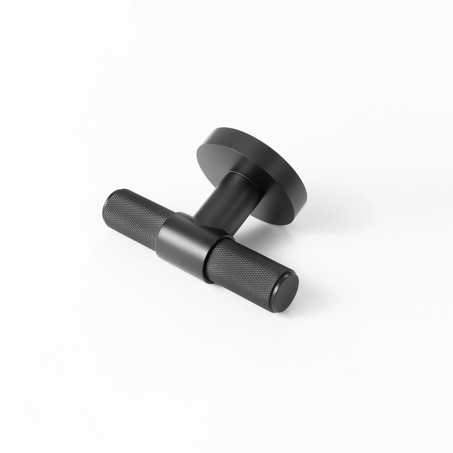 Heik black door knob with knurled pattern, horizontally positioned on white background.