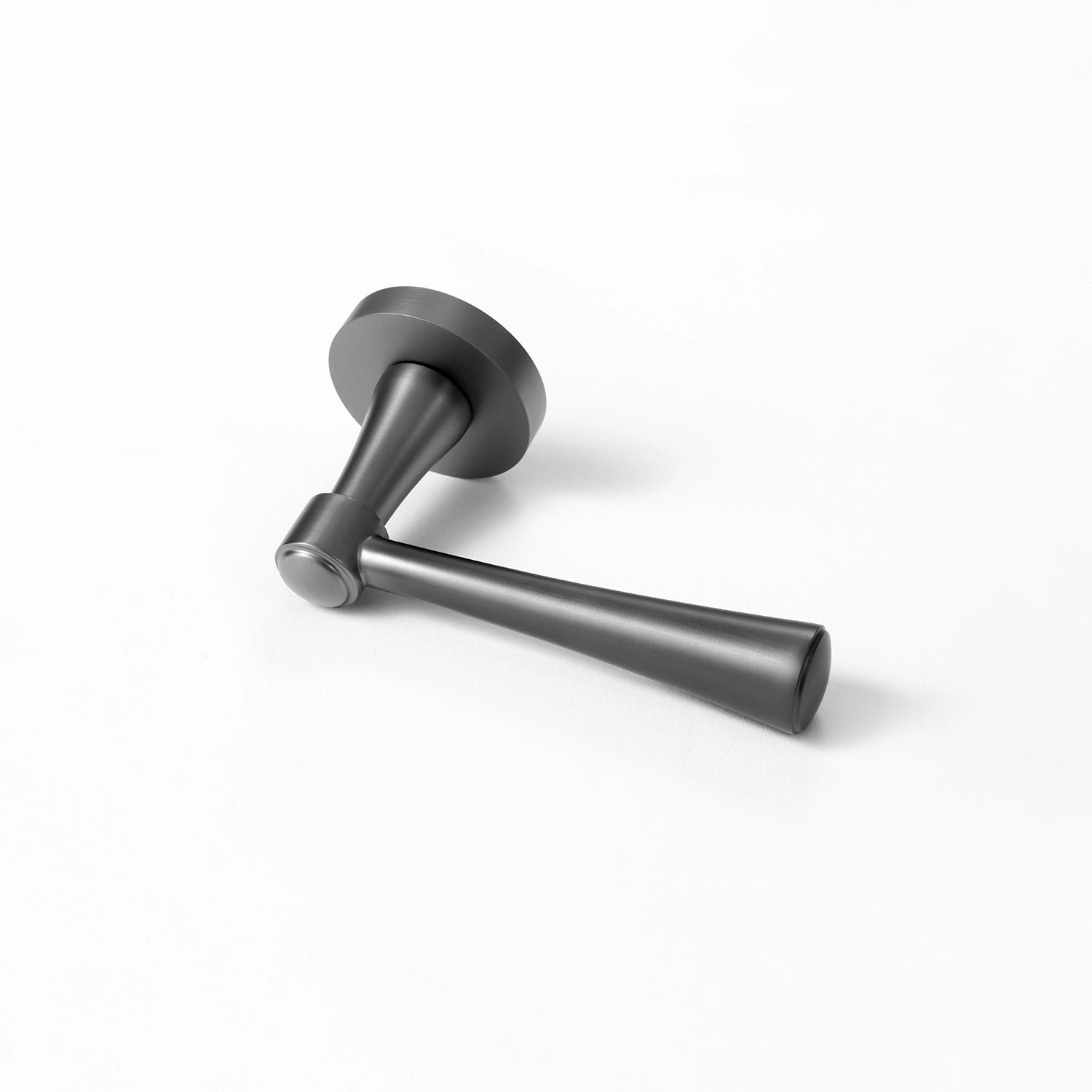 Hilda door handle in charcoal grey finish, positioned horizontally on a flat surface, showcasing streamlined cone design.