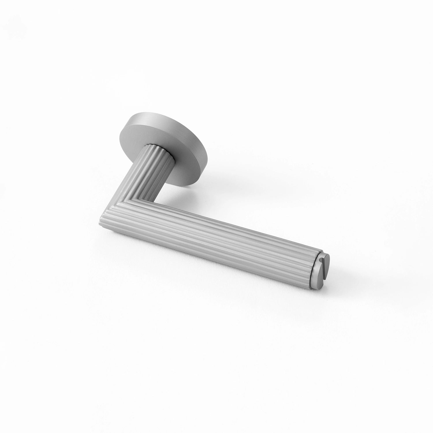 Midal internal door handle in nickel finish, positioned horizontally on a flat surface, showcasing a distinctive linear pattern for an elegant touch.