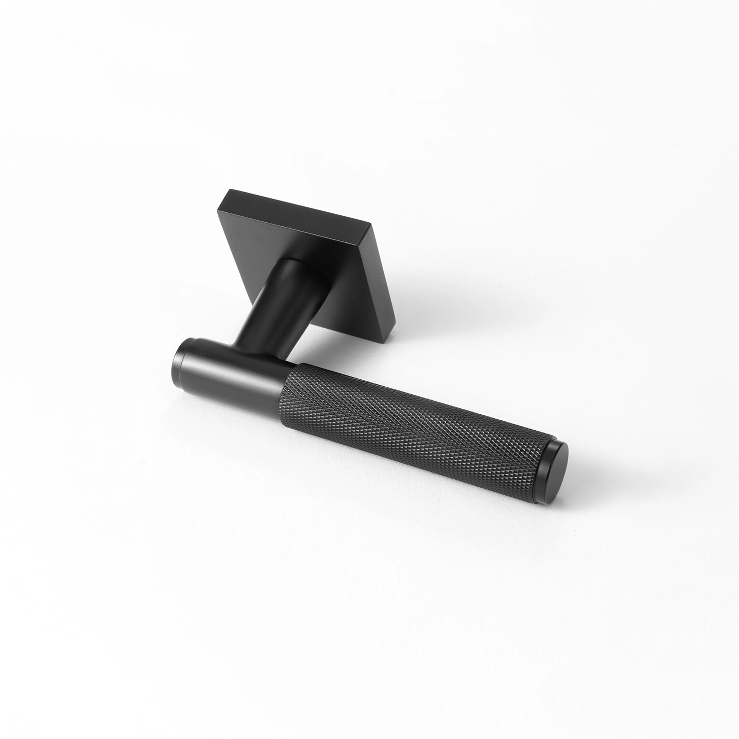 Svik-01 internal door handle in matte black finish with knurled pattern grip, positioned horizontally with square rose base.