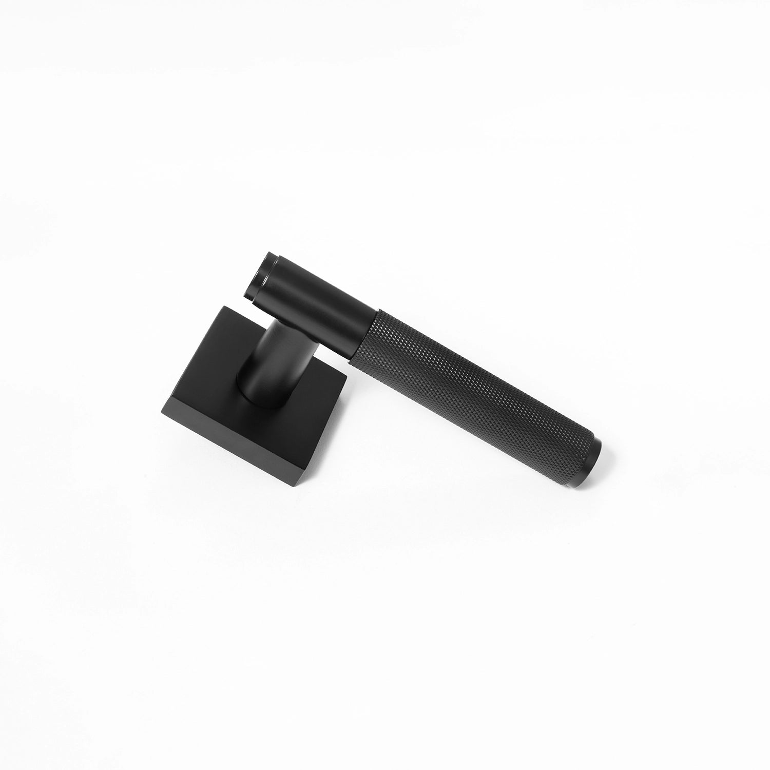 Svik-01 internal door handle in matte black finish with knurled pattern grip, standing upright on a square rose base.