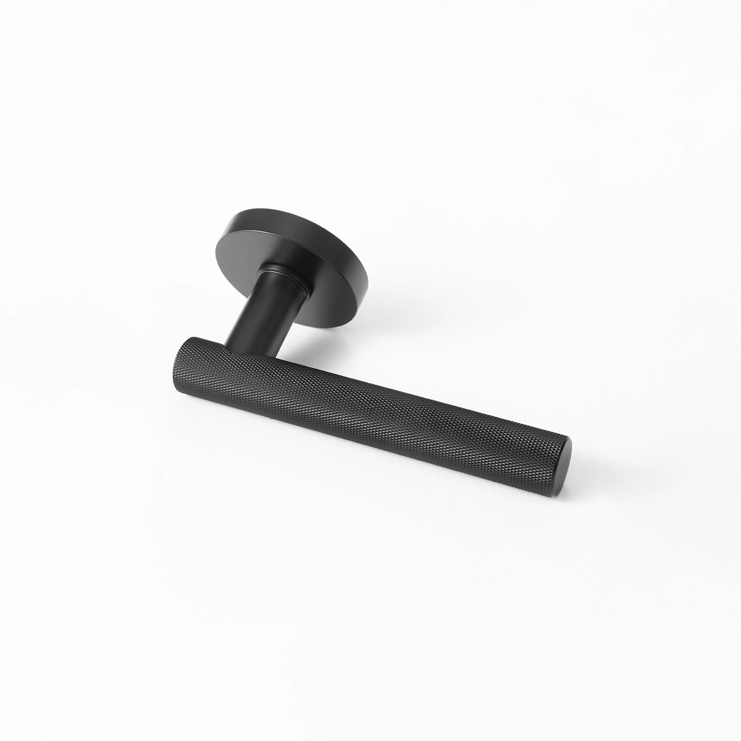 Tord-01 internal door handle in black finish, featuring a fully knurled pattern covering the entire handle, positioned horizontally on a white background.