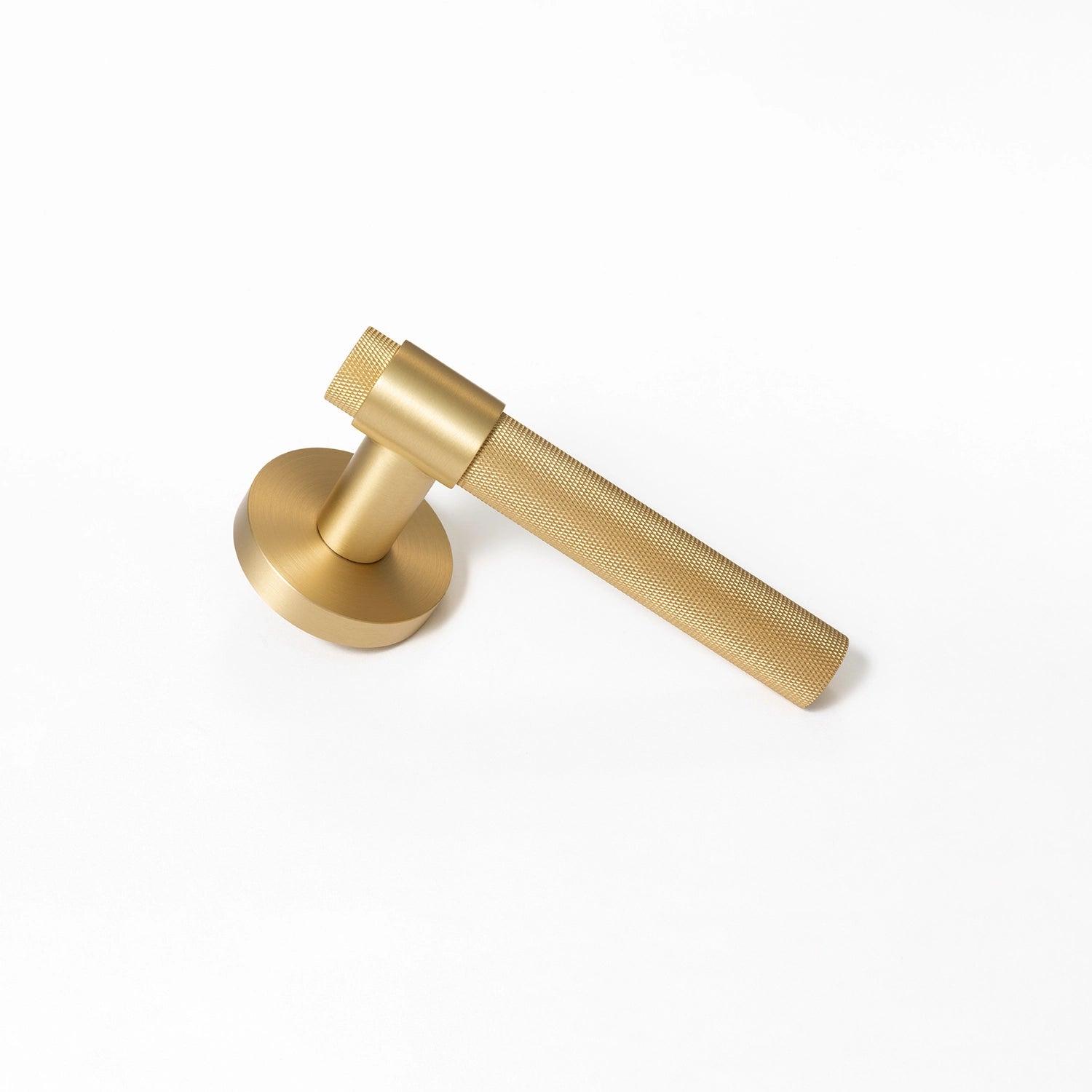 Tord-02 internal door handle in satin brass finish, with a large knurled grip, displayed on a white background.
