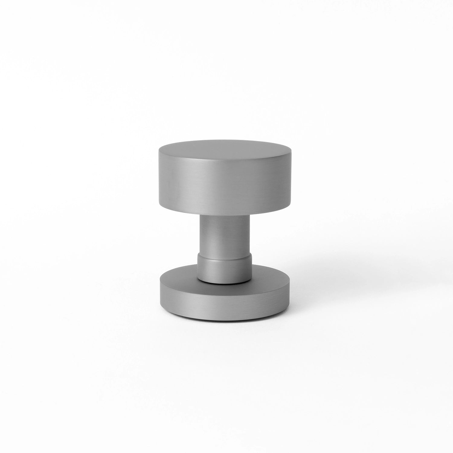 Solda door knob in nickel finish, showcased upright on a white background, highlighting its cylindrical and modern design.