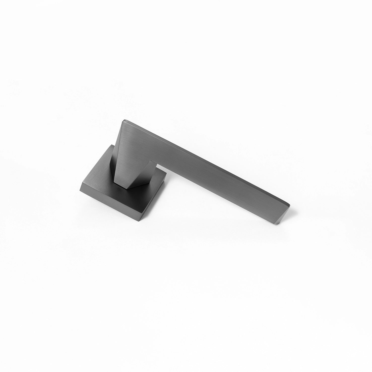 Tagg internal door handle in charcoal grey finish, featuring a minimalist square rose design and geometric lever profile, placed vertically on a white background.